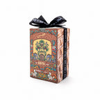 A rectangular decorative box with an ornate multicolor illustration and the word 'HAYA' on the front, tied with a black ribbon bow, photographed on a clean white background.